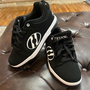 Heely’s.    Never worn.  Men’s size 8